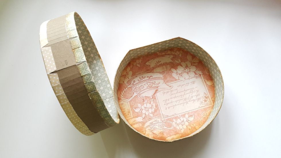 Cut strips of 2-1/2" papers and cover the rest of the inside, fold the extra half inch to outside and adhere