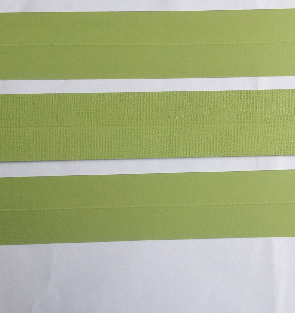 Cut strips of card stock at 3 3/4 x 1 3/4 inches and score in half length wise.