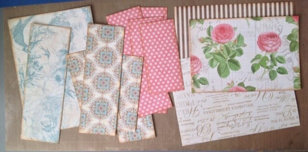 Cut strips of desired patterned paper from the 12 x 12 paper pad to cover the entire box. Cut 1/8" shorter on all sides, each side. Adhere.