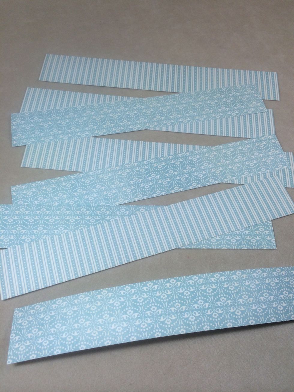 Cut strips of paper 1 1/4" x 7". Mix and match patterns if you like.
