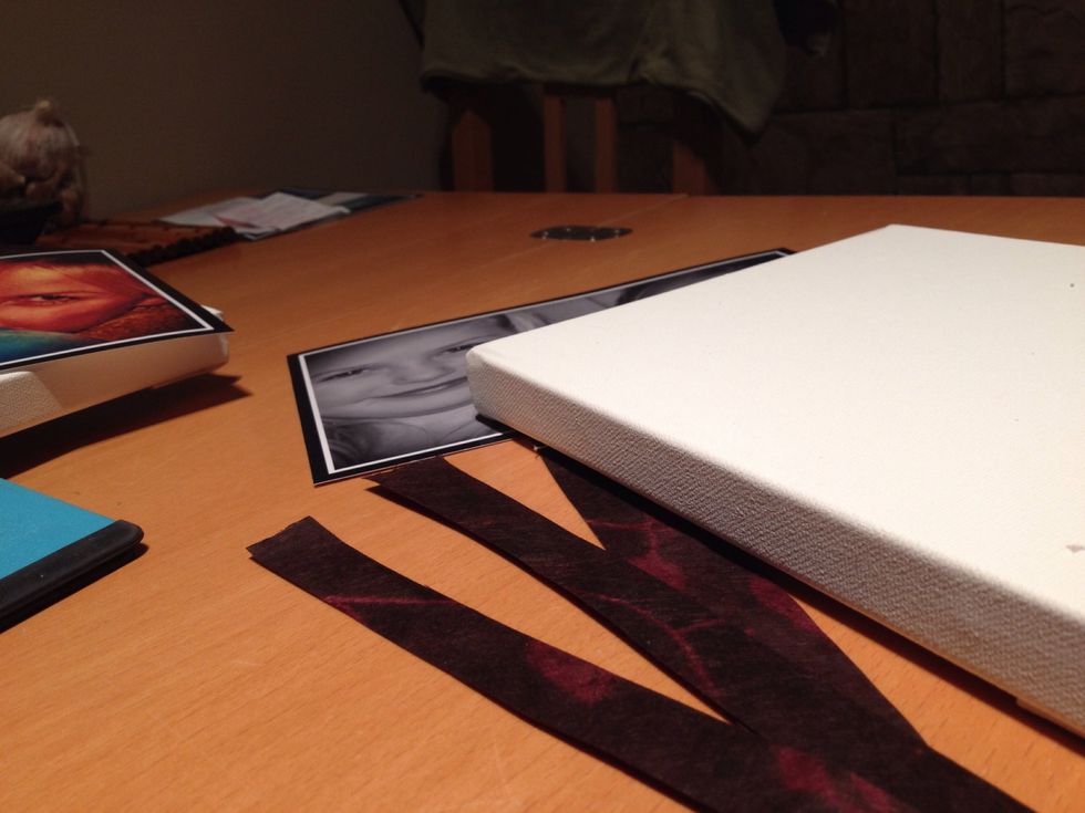 Cut strips of scrapbook paper to fit each side of the canvas. Apply mod podge liberally and glue strips on each side. Then glue the photograph on the top of the Canvas.Allow to dry completely