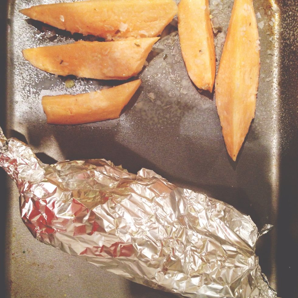 Cut sweet potato into sticks. Put on baking tray with fry light and season with a pinch of garlic salt. Put salmon on the side of the tray. Heat for 20 mins on 190 degrees celcius.