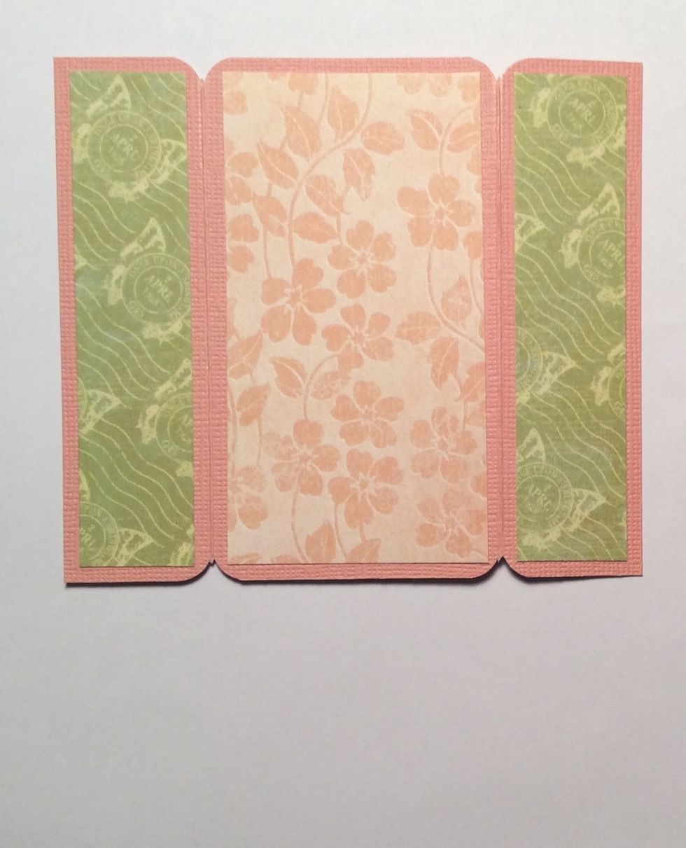 Cut tags mats at 7/8 x 3 3/4 inches and 2 x 3 3/4 inches and adhere as shown from chosen papers.