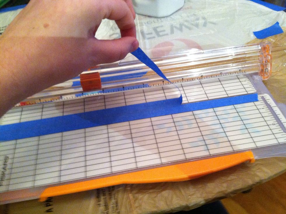 Cut tape and remove carefully from the paper cutter