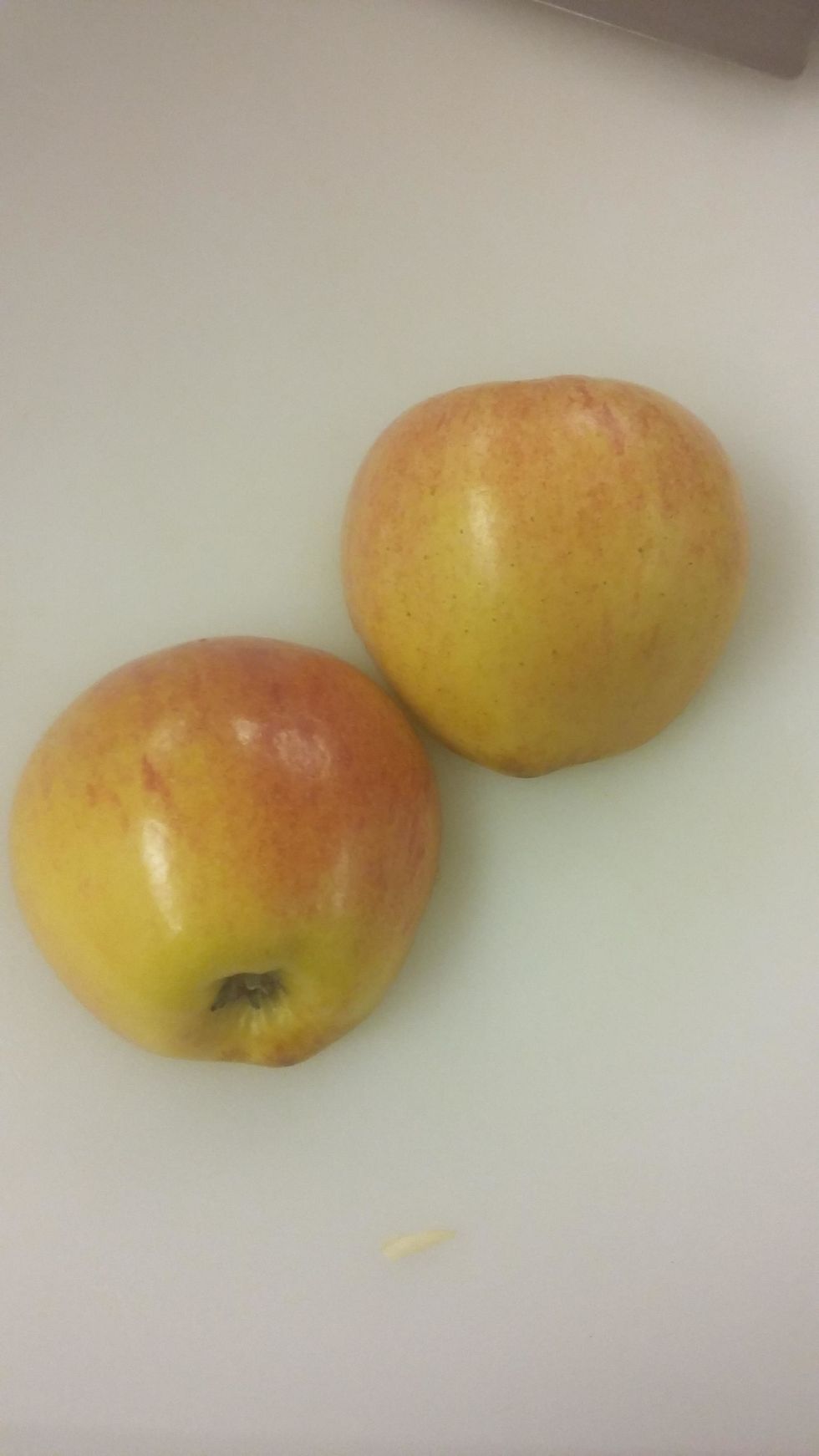 Cut the apple in a diagonal in half to get two halves with the chefs knife