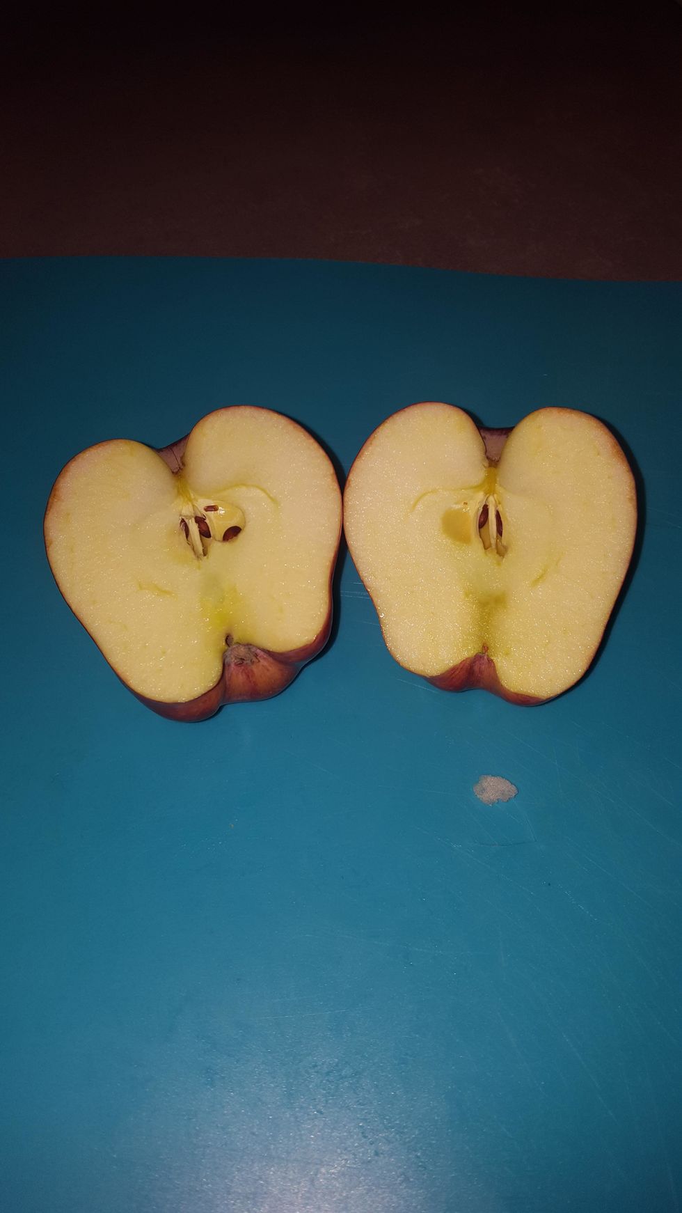 Cut the apple in half.