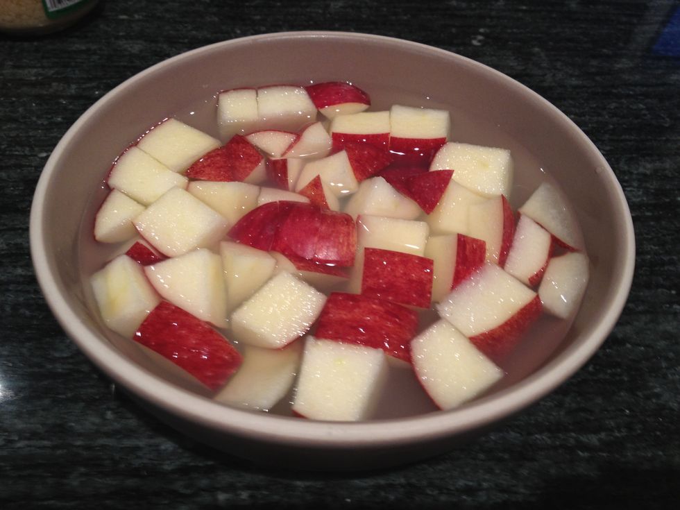 Cut the apple into small wedges, keeping the skin on. Soak in a bowl filled with some water and the juice of one lemon. Make sure to use a variety of apple that is very crisp.
