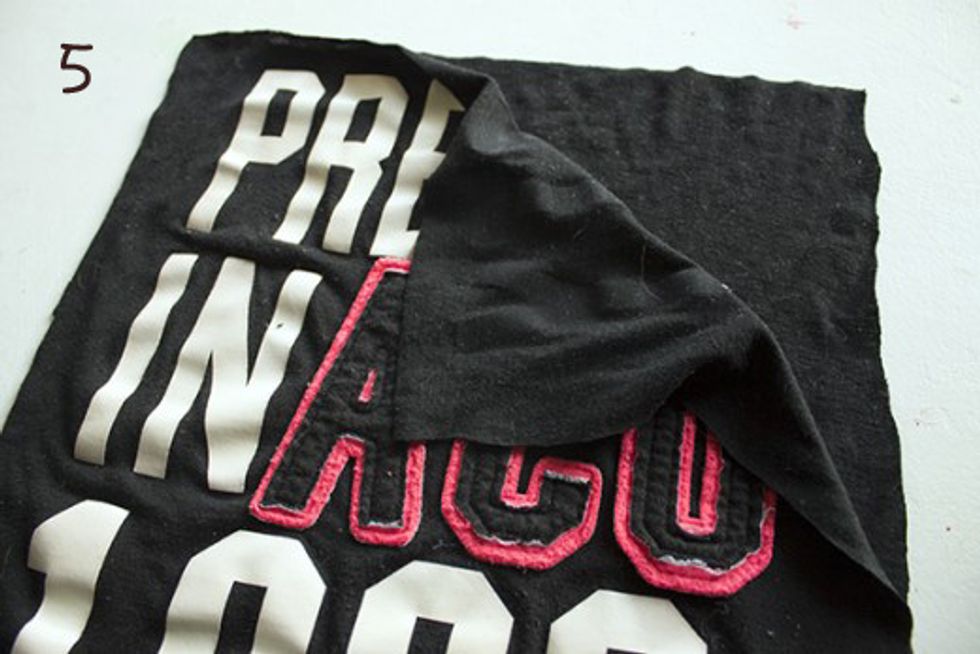 Cut the around the pattern. You will be left with two identical sized pieces of material.