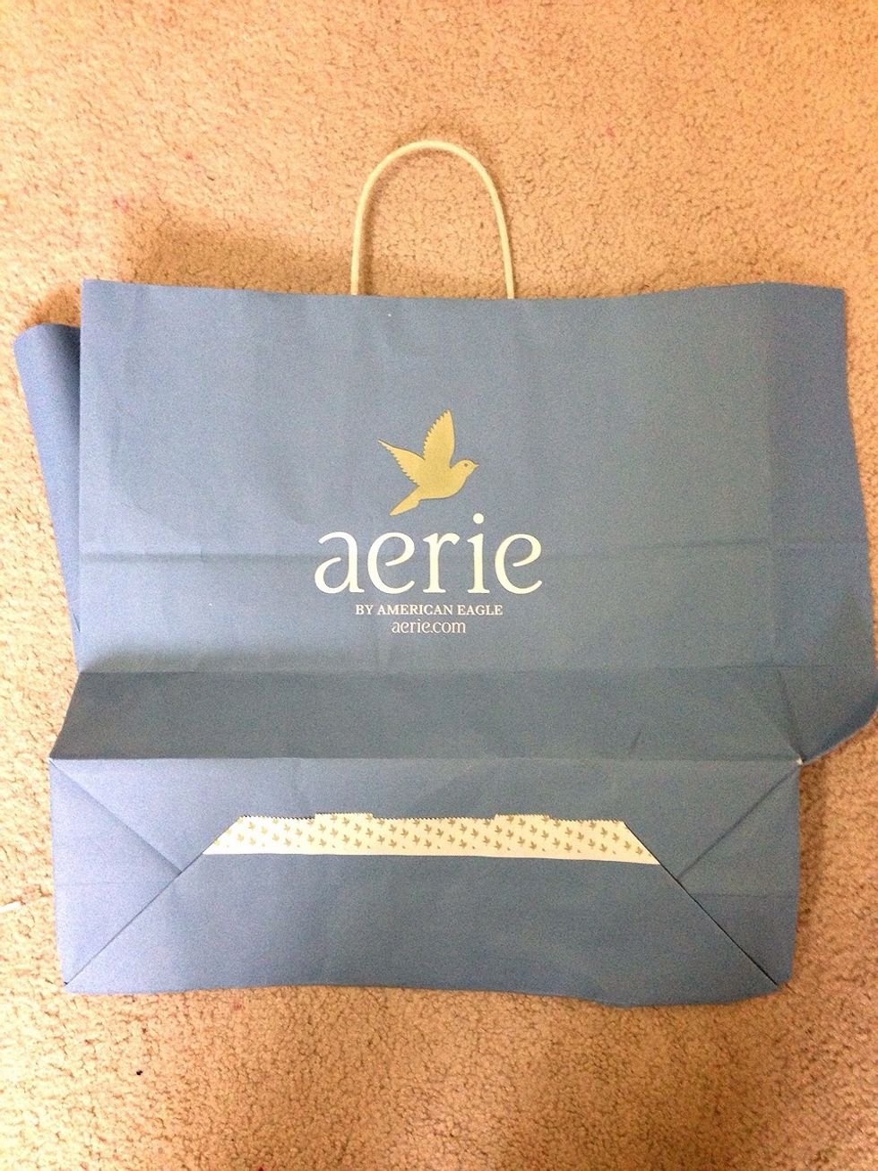 Cut the bag into strips appropriate to the size of your wax spill.