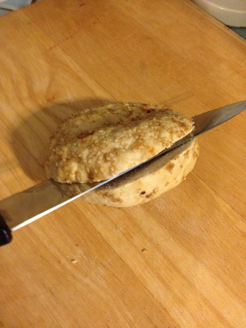 Cut the bagel in half.