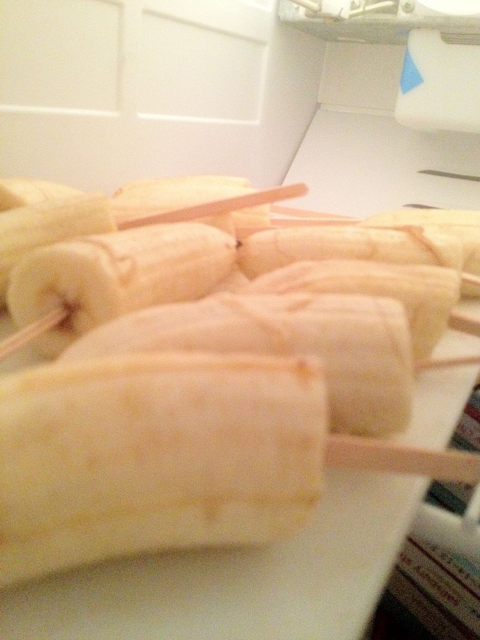 cut the bananas in half and insert a wooden stick, refrigerate until freezing