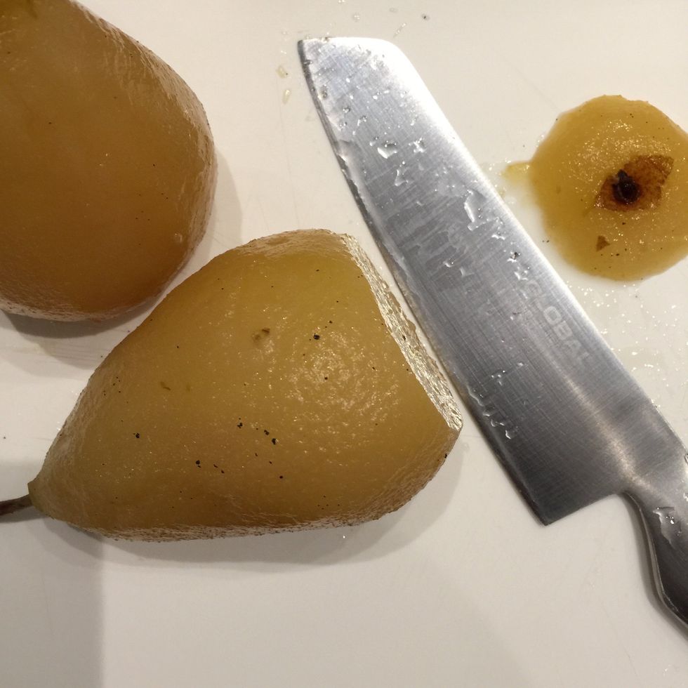 Cut the base so as the pear stands in the plate.