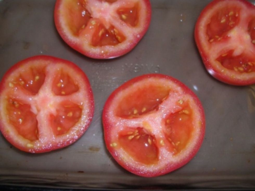 Cut the bigger tomatoes into slices about one and a have centimetre thick