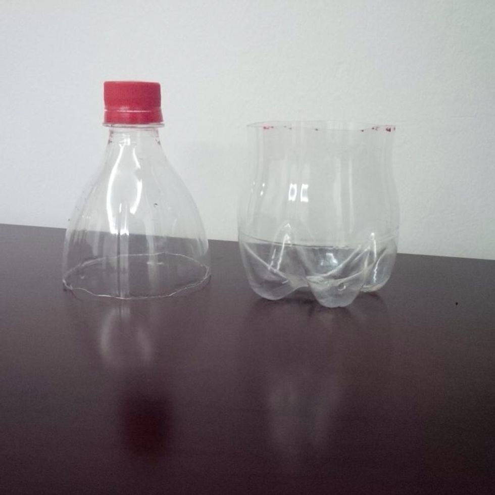 Cut the bottle and take the piece at the top and the piece at the bottom