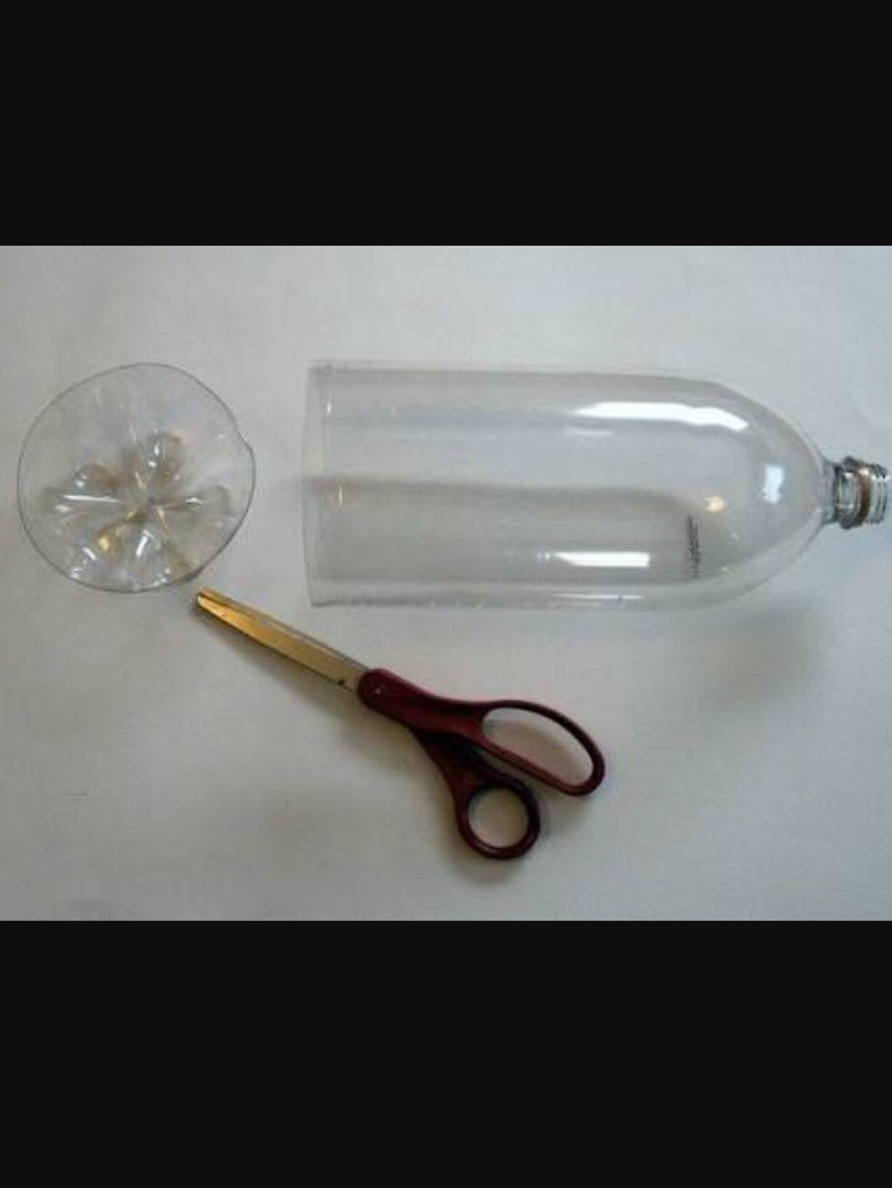 Cut the bottoms off of the bottles