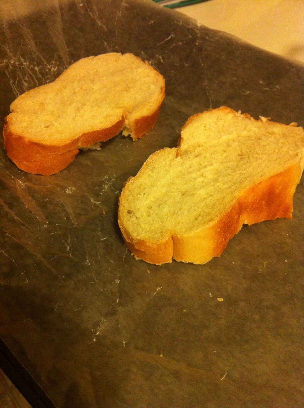 Cut the bread into slices and place onto wax paper or a pizza pan