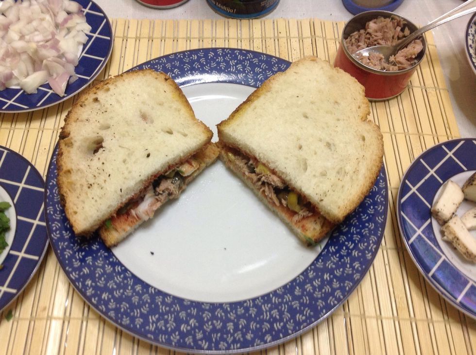 Cut the bread into two pieces.