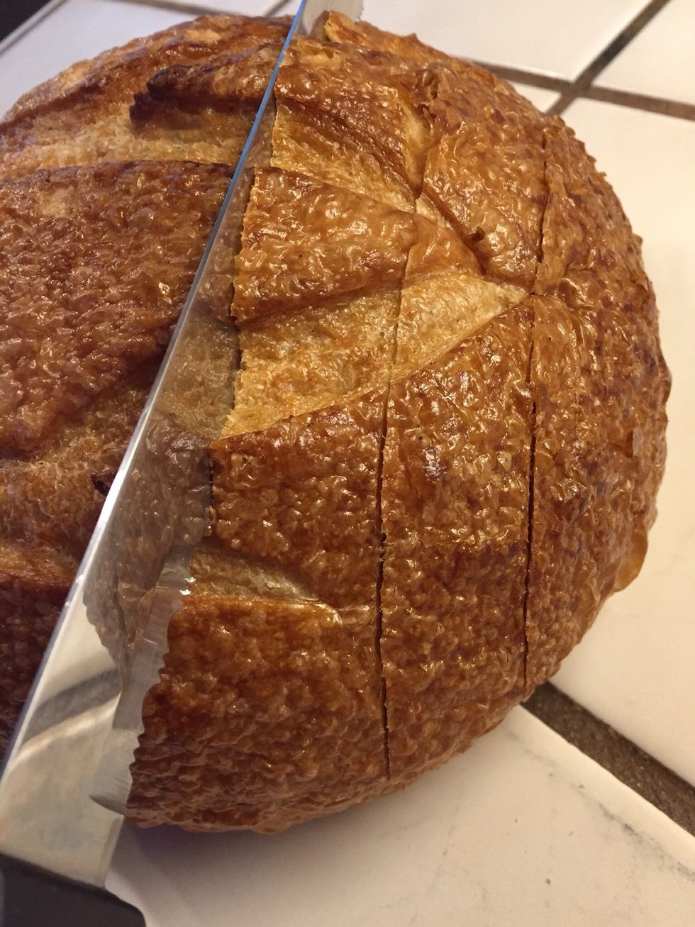 Cut the bread lengthwise and widthwise without cutting through to the bottom.