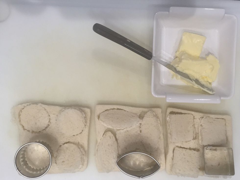 Cut The bread with a cutter You like or cut squares with a knife. Put butter on the bread