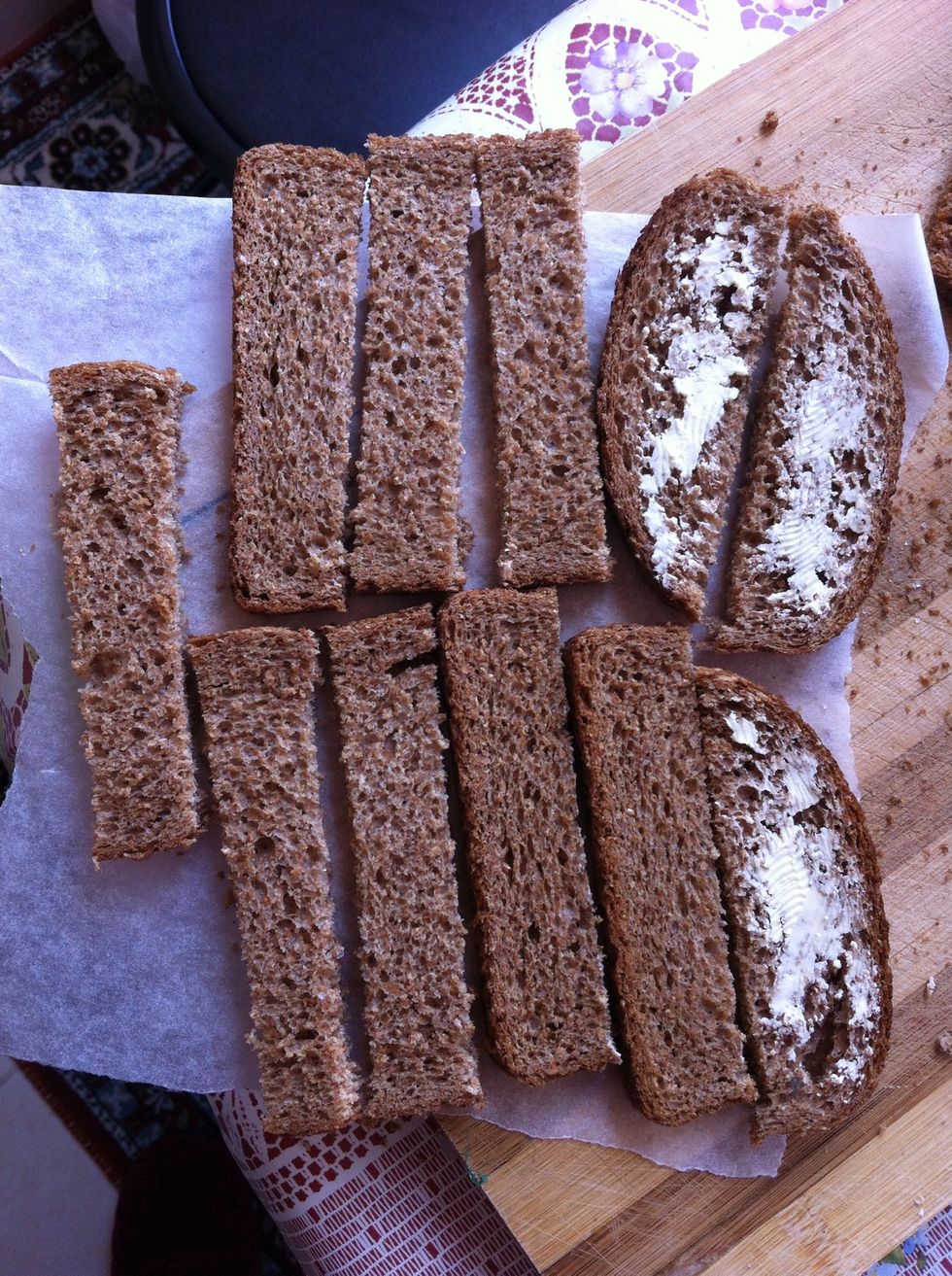 Cut the breads into long pieces like shown (I recommend you NOT TO butter the breads before putting them up in the oven. They will crack easily & you'll have too much grease later on. True story)