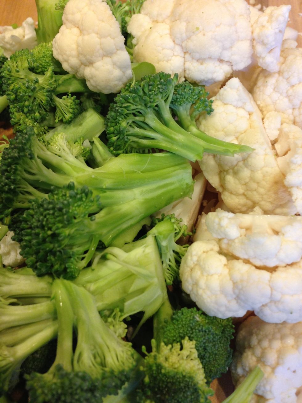 Cut the broccoli and the cauliflower into manageable pieces. This will help them soften during boiling.