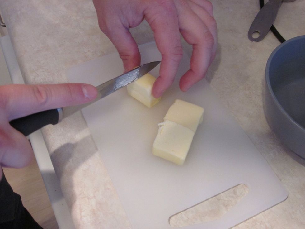 Cut the butter into cubes for melting. Pop it in your microwave for 30 seconds or until melted. If it doesn't melt all the way you should have made better cubes. Too late now, back to the microwave