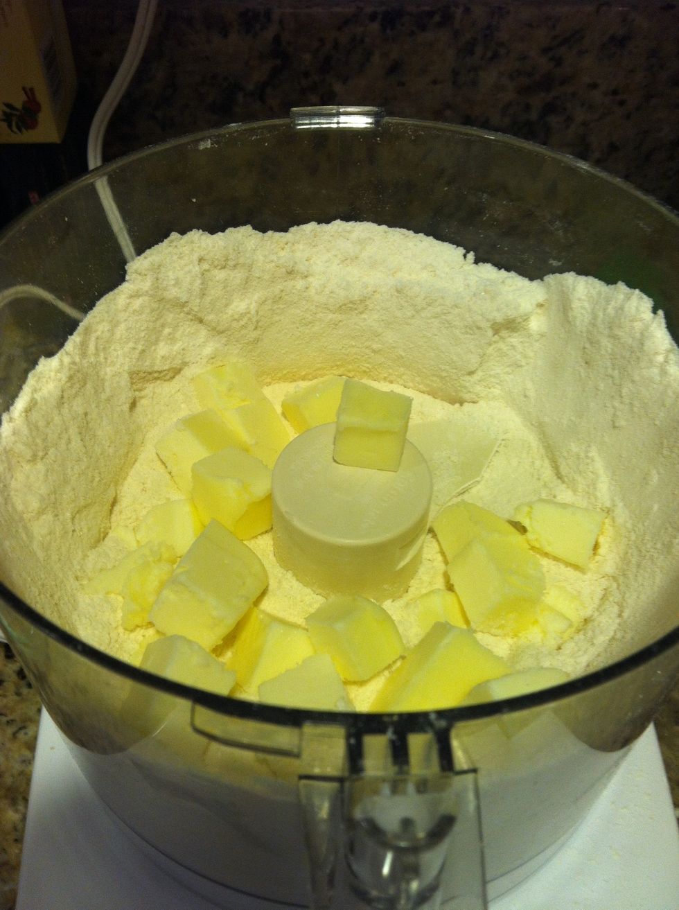Cut the butter into small pieces and add it to the flour mixture.