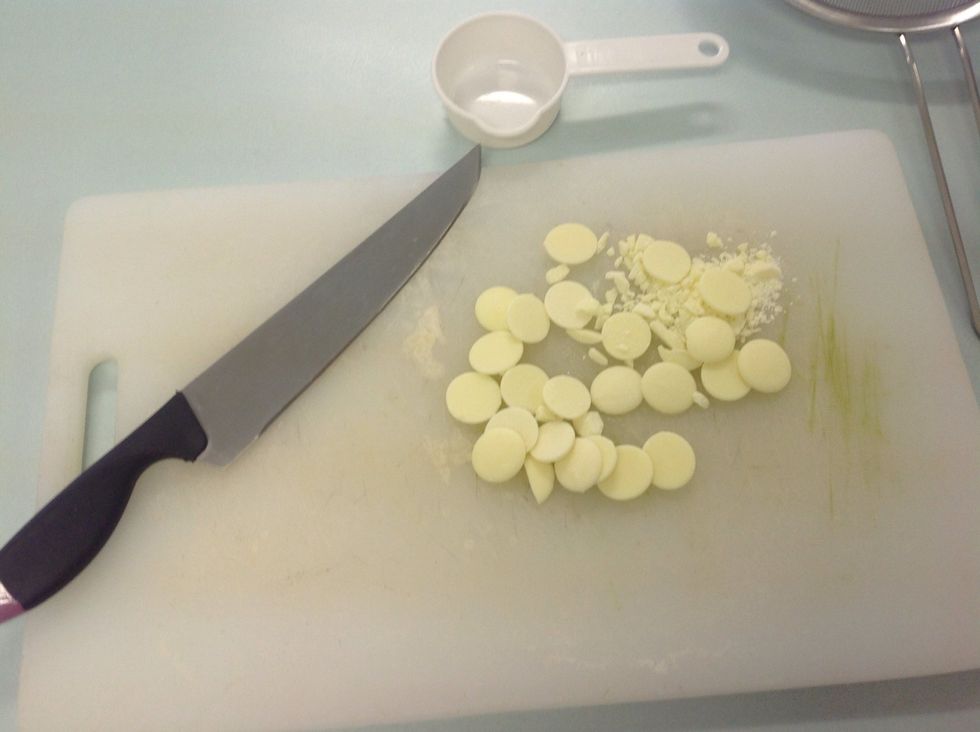 Cut the buttons up into small pieces. I kept twelve to put on top of my muffins for decoration. Add the chopped buttons to the flour and sugar