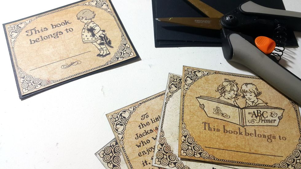 Cut the cards from \u201cAn ABC Primer\u201d paper and mat with black cardstock, these cards can be placed on top of the box or inside, like a deck of cards.