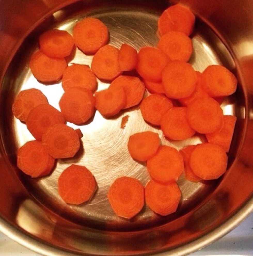 Cut the carrots in smaller pieces and put in a pan.