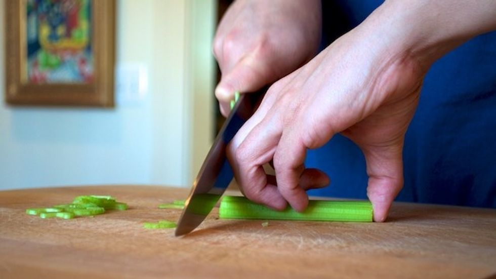 Cut the celery in thin slivers one stalk at a time. Be sure to curl you fingers!
