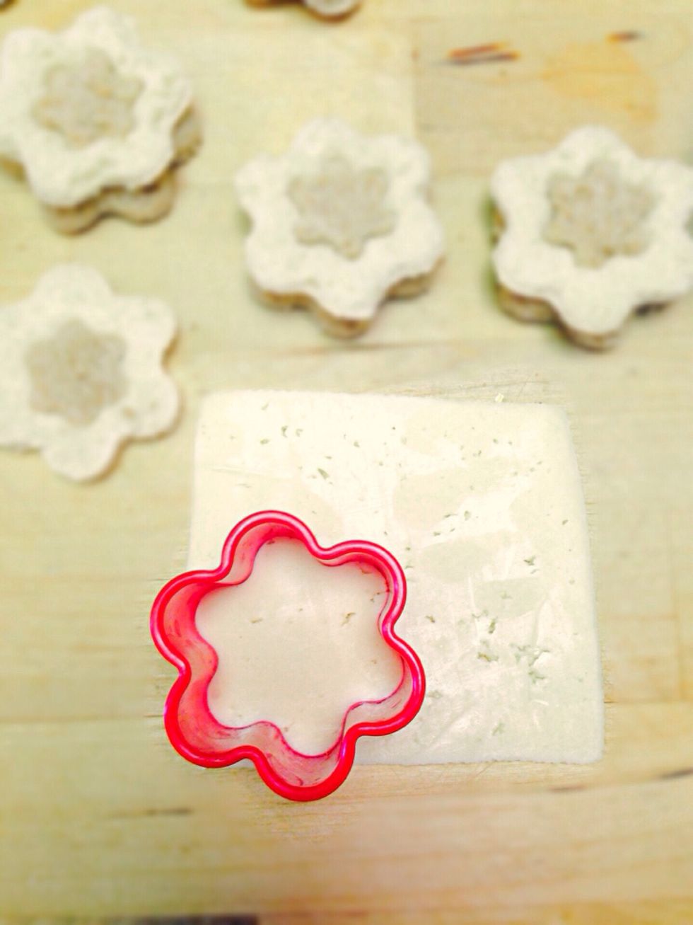Cut the cheese slices with the same flower cutter
