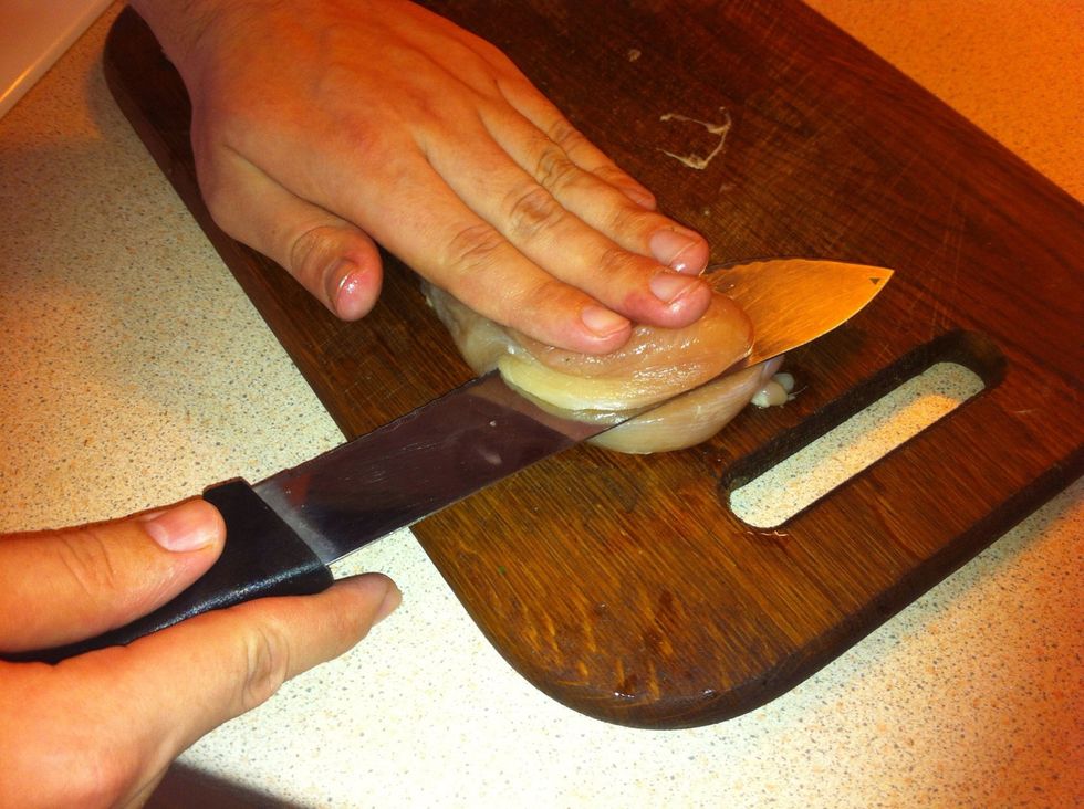 Cut the chicken breast into two parts.