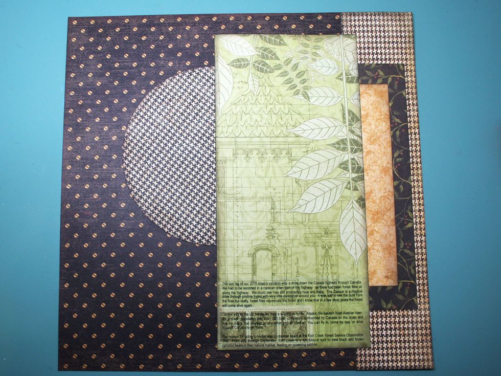 Cut the circle in half and adhere as shown in the photo, about 2" from the top of the page. Save the other half of the circle for another use.