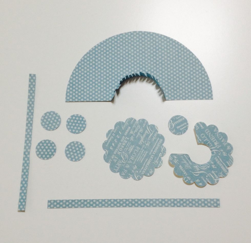 Cut the circle with circle cutter size 5 1/2' Punch and 2 scallops size 2 3/8' Punch 3circle size 3/8' Make 2 6x1/4'