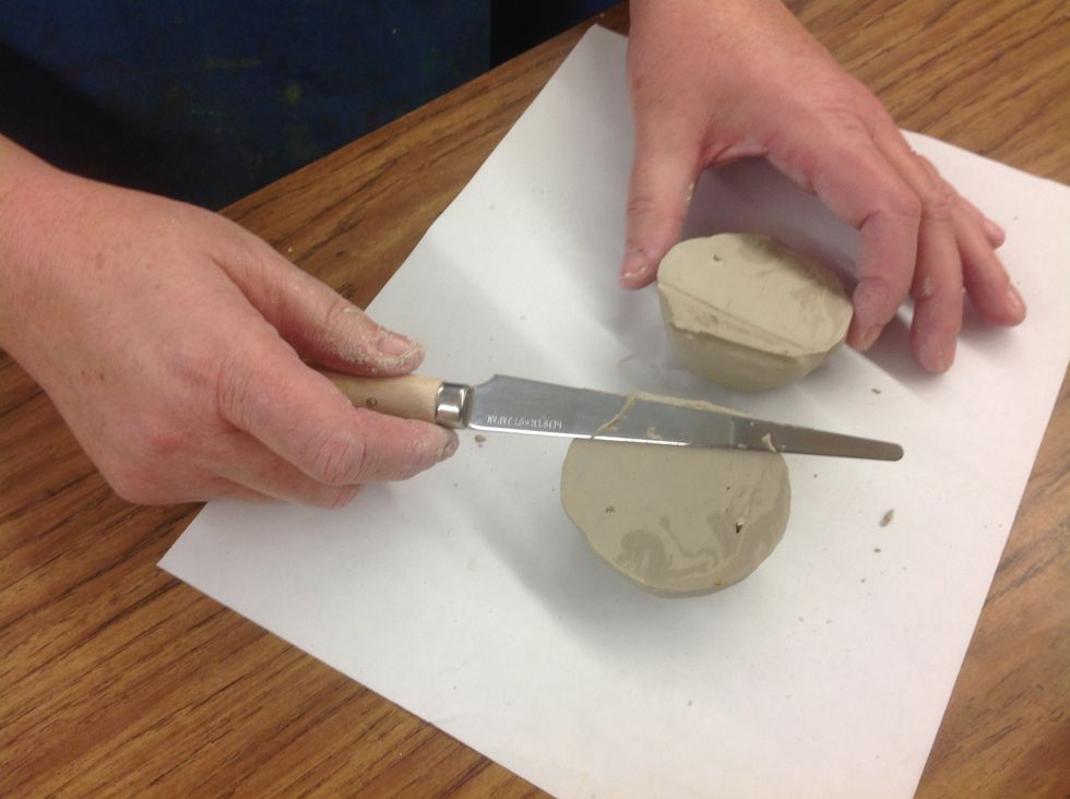 Cut the clay ball in half. Use one half to create your bowl base and the other for additional construction. TAKE MORE CLAY AS NEEDED.