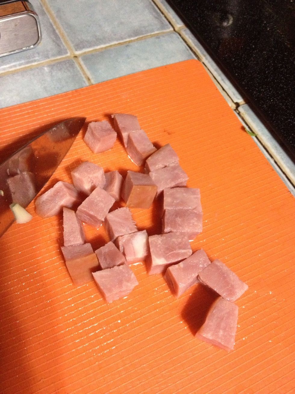 Cut the cooking ham into little pieces.