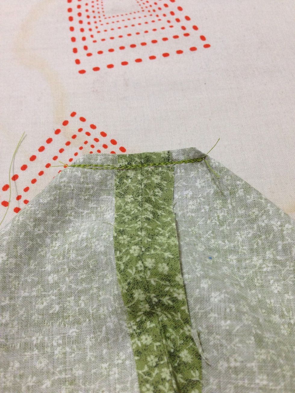 Cut the corner off 1/2" above the seam.