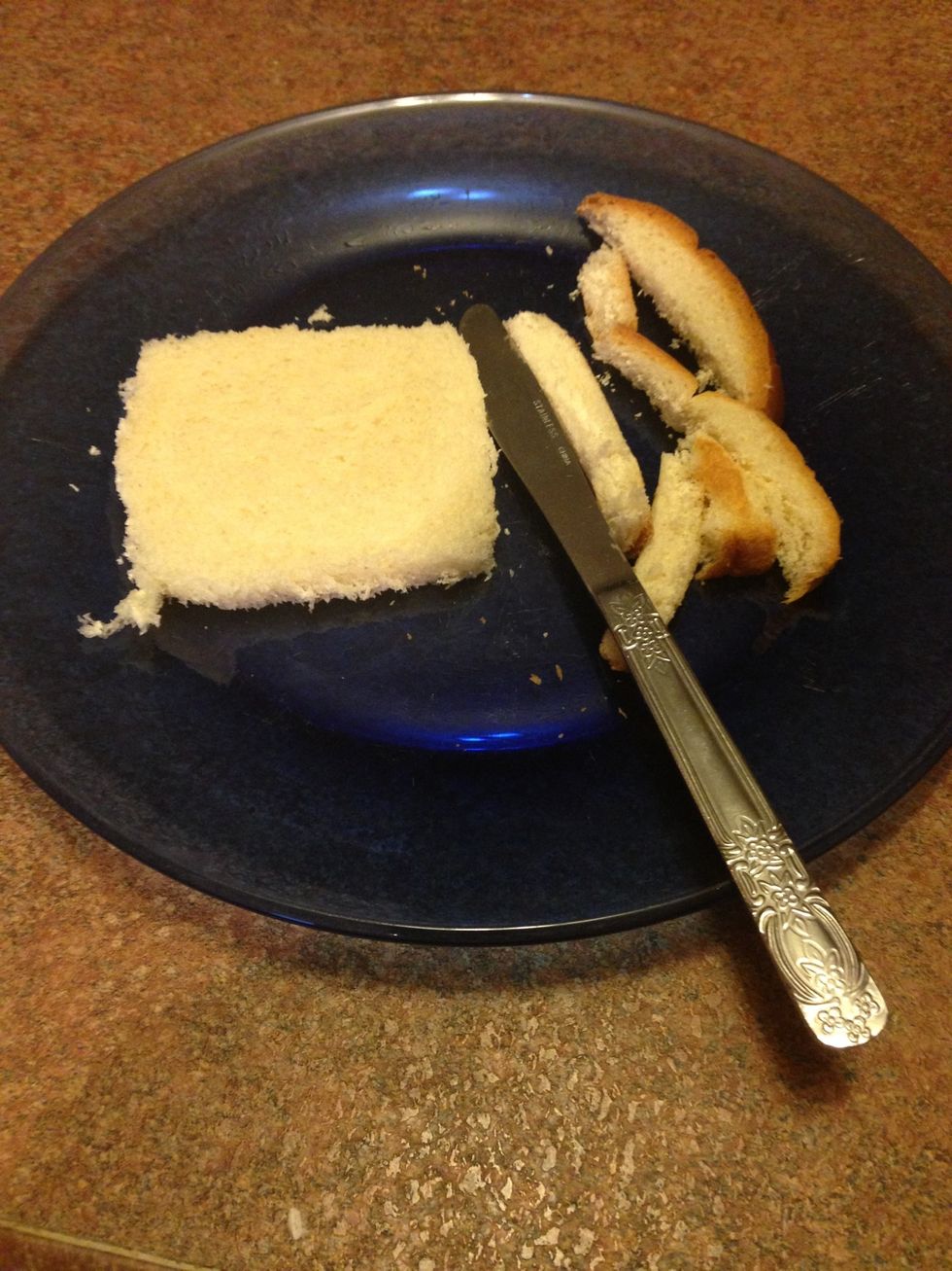 Cut the crust off each piece of bread.
