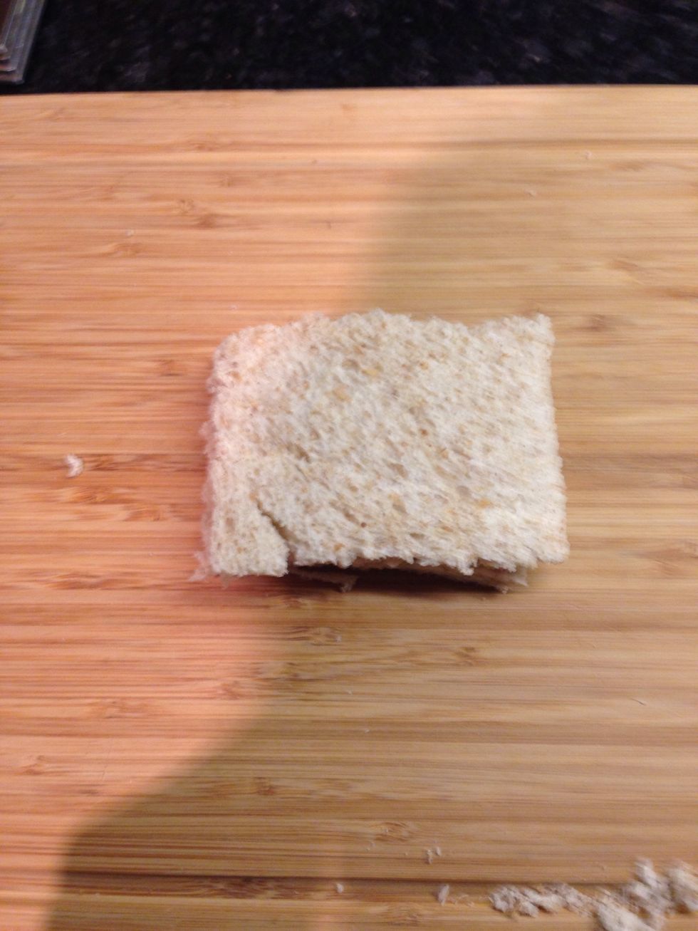Cut the crusts off your bread slices on top of each other