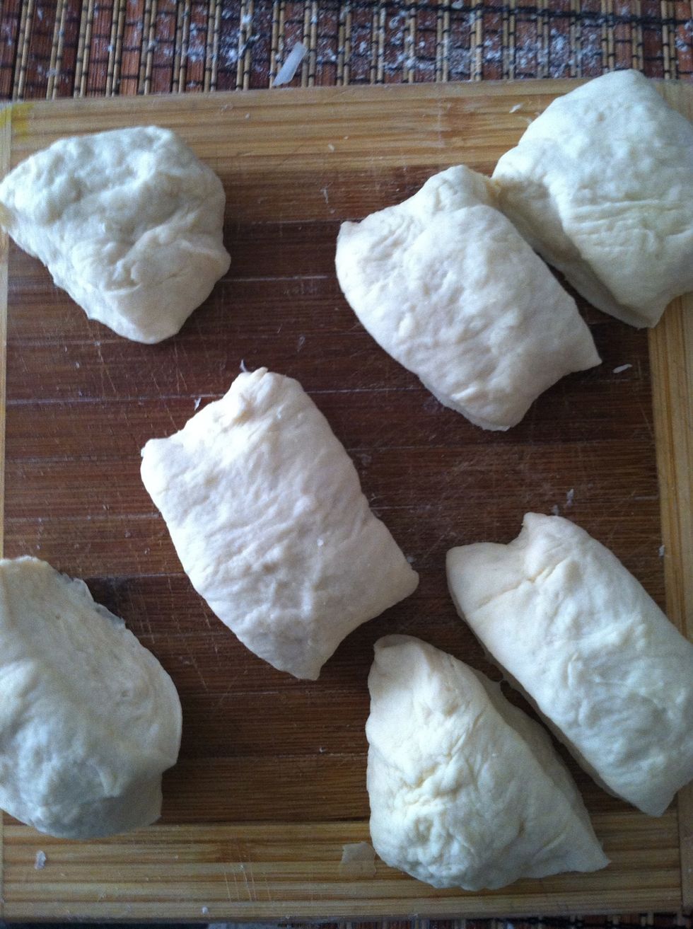 Cut the donut in half. Put one half away and use another time. Take the other half and cut into 6 or 7 smaller pieces