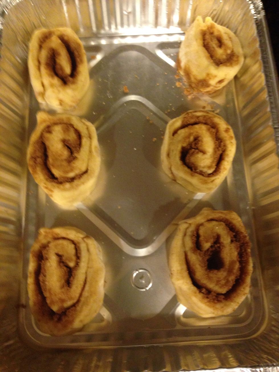 Cut the dough into 12 equal pieces; place the pieces in a greased 9x13 inch baking pan, or 12 inch deep dish pizza pan.