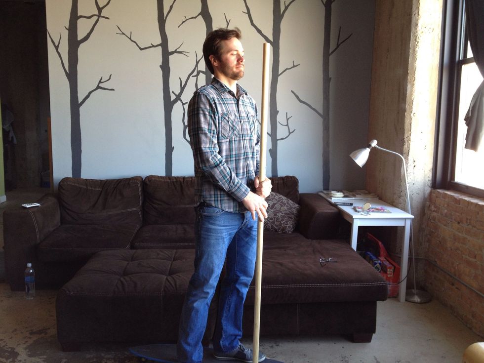 Cut the dowel to a length between your chin and forehead. Remember stand on the board you will use to get an accurate measurement.