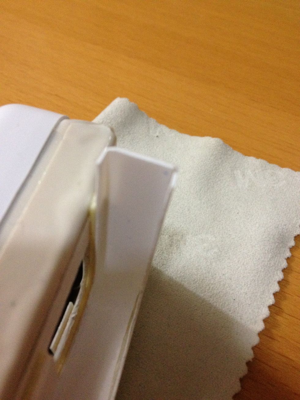 Cut the edges around the corners and stick them together to form a clip that is just as thick as the iPhone.