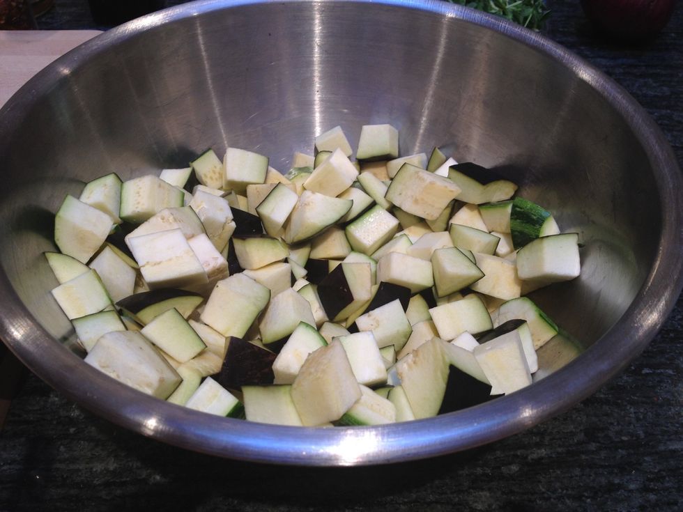 Cut the eggplant and the zucchini into 1/4 inch chunks. Toss with some olive oil, sea salt and pepper.