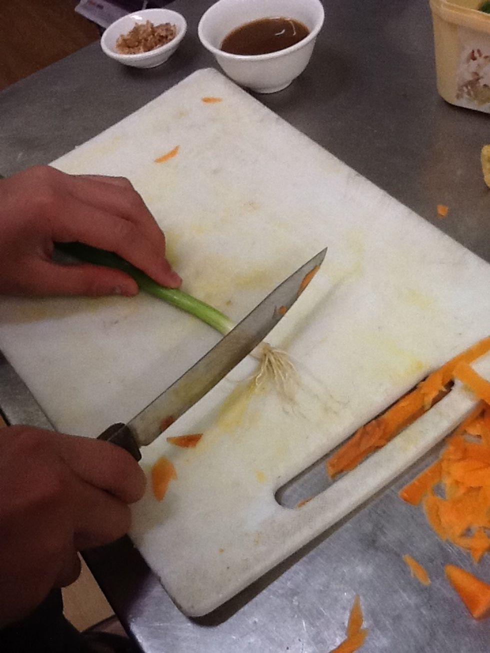 Cut the end off the spring onion