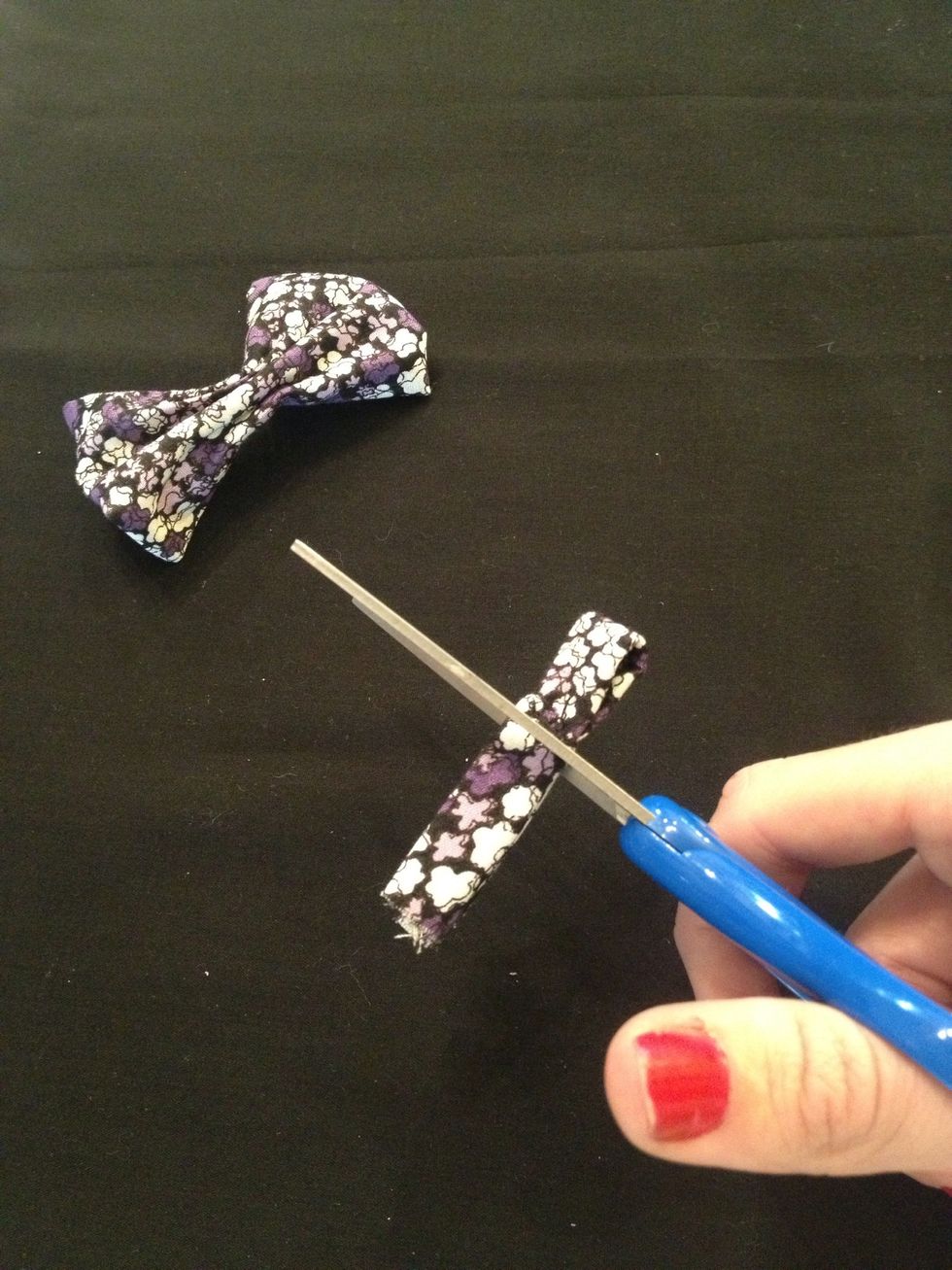 Cut the excess fabric off of the loop.