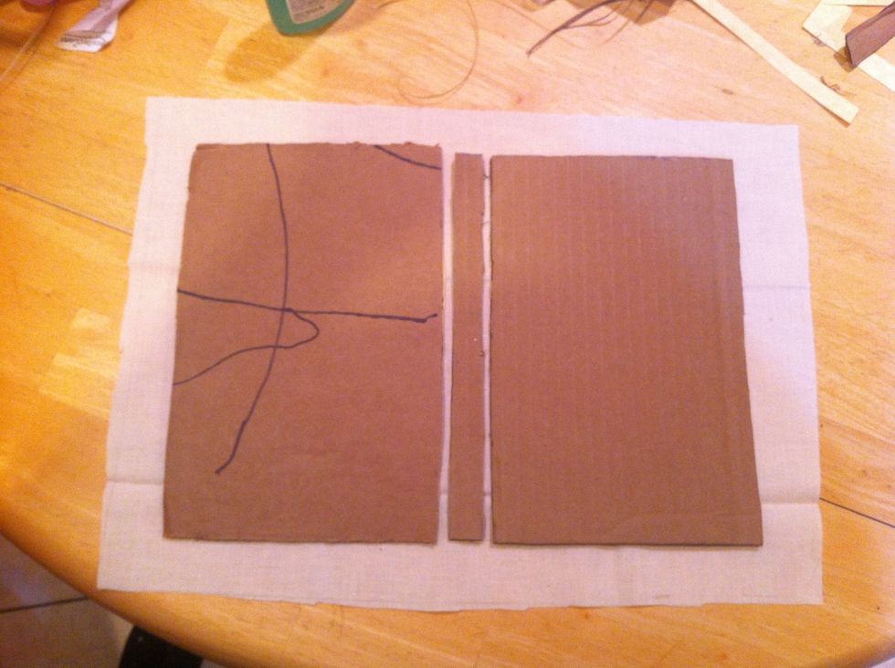 Cut the fabric about an inch bigger all around your covers