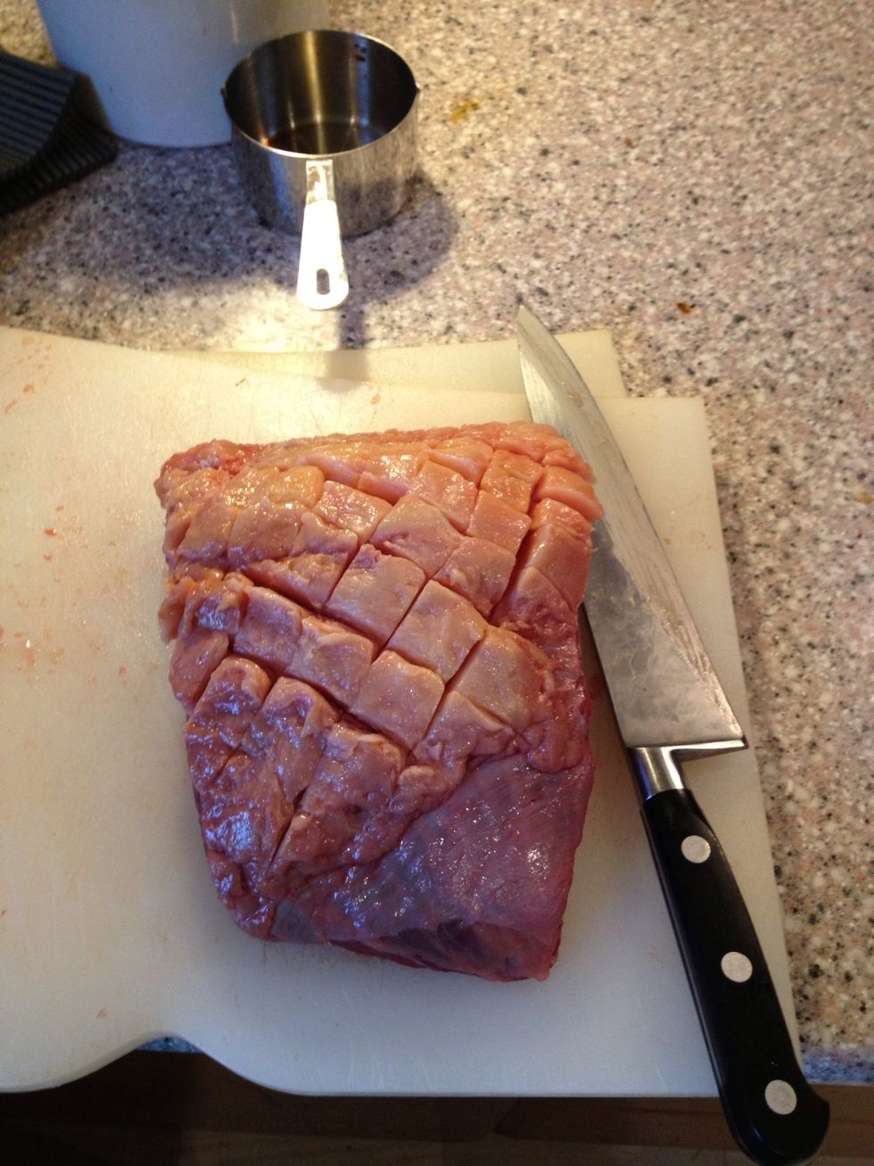 Cut the fat off or leave in on, up to you, but the meat is quit lean, so the fat will as it melts baste the meat. Cut the fat with a sharp knife, don't cut into the meat.