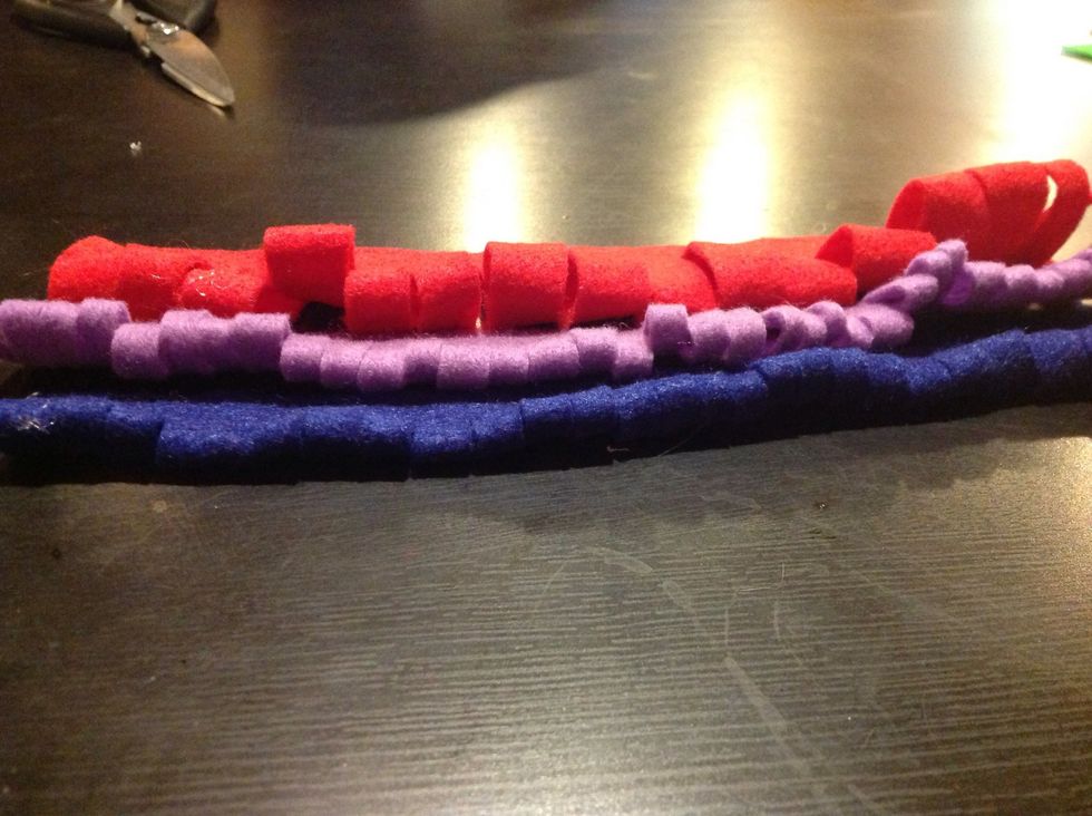 Cut the folded side (opposite of where you glued) in even intervals about half way through the width of the felt